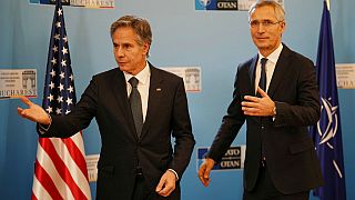 US Secretary of State Antony Blinken gestures with NATO Secretary-General Jens Stoltenberg in Bucharest, Romania.
