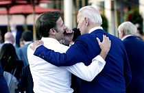 Macron whispers to U.S. President Joe Biden following their dinner at the G7 Summit in Elmau, Germany, June 26, 2022.