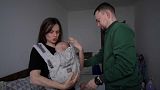 Oleksandra Darmohrai and Andrij Freel Shalimov with one of their children. 