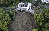 A house is left standing on the edge of a landslide in Casamicciola, on the southern Italian island of Ischia, in this picture taken Sunday, Nov. 27, 2022.
