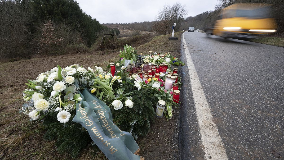 Flowers and candles lie near Kusel at the scene where the two police officers were shot.