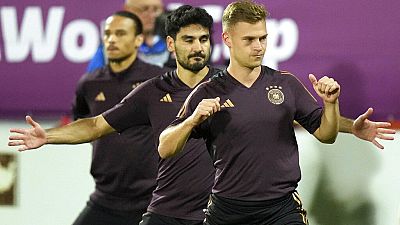 Germany's Joshua Kimmich, foreground, Ilkay Gundogan and Leroy sane warm up during a training session at the Al-Shamal stadium.