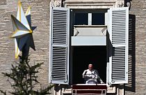 Pope Francis delivers a speech from the window of the apostolic palace overlooking St. Peter's Square during his Angelus prayer on November 27, 2022.