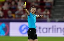 Referee Stephanie Frappart shows a yellow card during a Women Euro 2022 match