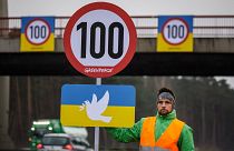 Greenpeace activists protest for temporary speed limits on German motorways.