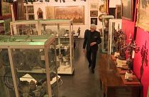 Auctioneer Serge Hutry surveys the contents of the Vanderkindere auction room