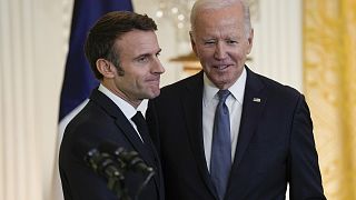 President Joe Biden stands with French President Emmanuel Macron after a news conference in the East Room of the White House in Washington DC. Thursday, 1 December 2022.