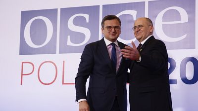 Polish Minister of Foreign Affairs Zbigniew Rau, welcomes his Ukrainian counterpart Dmytro Kuleba, during an OSCE meeting