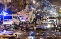 Police cars drive through the main boulevard in Brussels, 27 November as violence broke out during and after Morocco's 2-0 win over Belgium