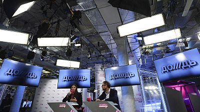 Co-owners of cable channel Dozhd (TV Rain) attend a press conference at the channel office in Moscow in February 2014