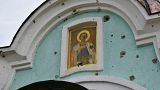 An Orthodox icon is seen on a damaged church in the retaken village of Bohorodychne, eastern Ukraine, 22 October 2022