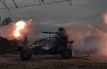 Ukrainian servicemen fire toward Russian positions in the frontline near Kherson, southern Ukraine.