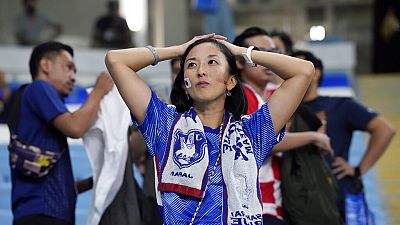 A fan of Japan reacts after Croatia win in the World Cup round of 16 match between Japan and Croatia at the Al Janoub Stadium in Al Wakrah, Qatar, Monday, Dec. 5, 2022.