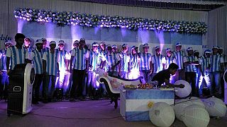 A group of Indian Argentina football supporters prepare for special themed wedding party