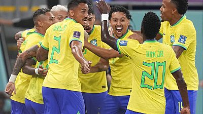 Brazil's players celebrate at the end of the World Cup round of 16 soccer match between Brazil and South Korea, at the Stadium 974 in Doha, Qatar, Monday, Dec. 5, 2022