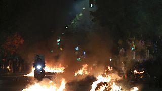 Flaming rubbish bins outside the Ippokrateio General Hospital, in Greece's second largest city of Thessaloniki, on Monday, Dec 5, 2022.