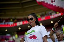 A football fan wears a T-shit demanding freedom for women in Iran in memory of Mahsa Amini at the Ahmad Bin Ali Stadium in Al Rayyan , Qatar, Friday, Nov. 25, 2022.