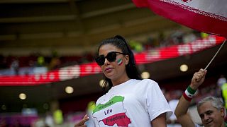 A football fan wears a T-shit demanding freedom for women in Iran in memory of Mahsa Amini at the Ahmad Bin Ali Stadium in Al Rayyan , Qatar, Friday, Nov. 25, 2022.