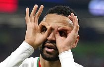 Morocco's Youssef En-Nesyri celebrates after he scored his side's second goal during the World Cup group F soccer match between Canada and Morocco, 1 Dec, 2022. 