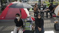 Activists protest in front of the parliament building in Jakarta, Indonesia, Tuesday 6 Dec 2022
