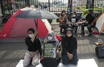 Activists protest in front of the parliament building in Jakarta, Indonesia, Tuesday 6 Dec 2022