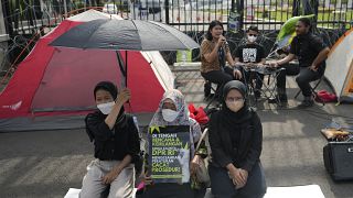 Activists protest in front of the parliament building in Jakarta, Indonesia, Tuesday 6 Dec 2022