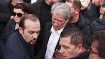 Albanian opposition leader Sali Berisha was punched in the face by a male bystander during a protest in Tirana on Tuesday.