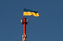 The Ukrainian flag flutters on top of the Daugavpils TV and Radio tower in Daugavpils, a southeastern Latvian city.