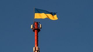 The Ukrainian flag flutters on top of the Daugavpils TV and Radio tower in Daugavpils, a southeastern Latvian city.
