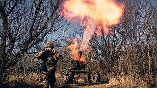 Ukrainian soldiers fire at Russian positions in the frontline near Bakhmut in the Donetsk region.