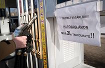 A sign on a pump in Martonvasar, Hungary, warns customers that they can only purchase 2 litres of fuel at the regulated price.