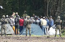 Polish security forces block migrants stuck on the border with Belarus in Usnarz Gorny, Poland, Sept. 1, 2021.