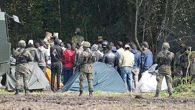 Polish security forces block migrants stuck on the border with Belarus in Usnarz Gorny, Poland, Sept. 1, 2021. 