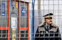  Romanian border police officer stands guard at the railway border crossing point between Romania and Moldova in Ungheni, Romania, on Jan. 18, 2011. 