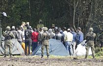 Polish security forces block migrants stuck on the border with Belarus in Usnarz Gorny, Poland