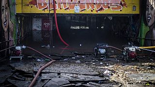 Pumps remove water from a flooded tunnel in Lisbon, with heavy rains forecast until Friday.