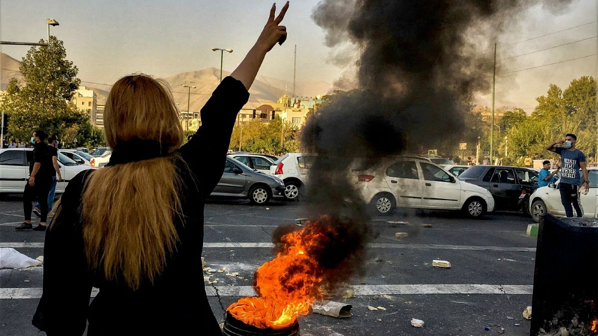 Iranians protests the death of 22-year-old Mahsa Amini after she was detained by the morality police, in Tehran, Oct. 1, 2022.