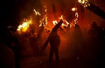 Villagers hold burning brooms during 'Los Escobazos' Festival in Jarandilla de la Vera, Spain