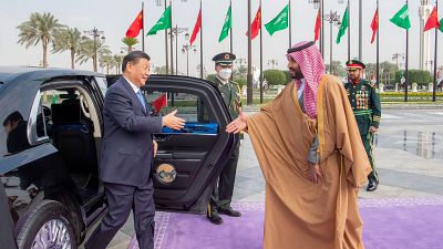 Chinese President Xi Jinping, left, shakes hands with Saudi Crown Prince and Prime Minister Mohammed bin Salman