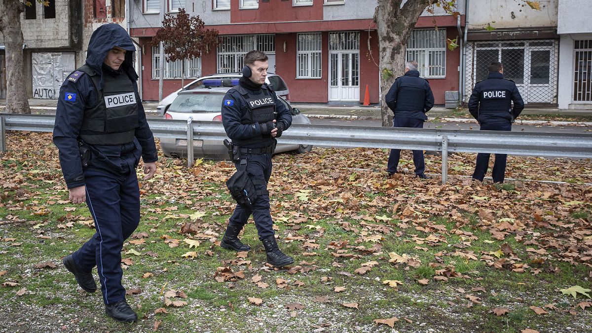 Kosovo police officers guard the offices of the Central Election Committee in ethnically divided town of northern Mitrovica, 9 December 2022