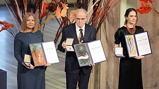 Natalia Pinchuk, the wife of imprisoned Ales Bialiatski, Yan Rachinsky, chairman of Memorial and Oleksandra Matviychuk, head of Ukraine's Centre for Civil Liberties pose