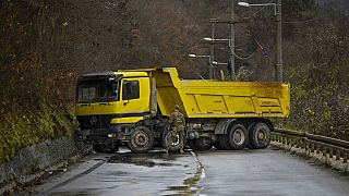 Trucks used as barricade are seen on a road in northern Kosovo, Sunday, Dec. 11, 2022.