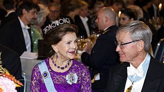 Sweden's Queen Silvia and Carl-Henrik Heldin, chairman of the Nobel Foundation, during the Nobel Prize Banquet at the Town Hall in Stockholm. 