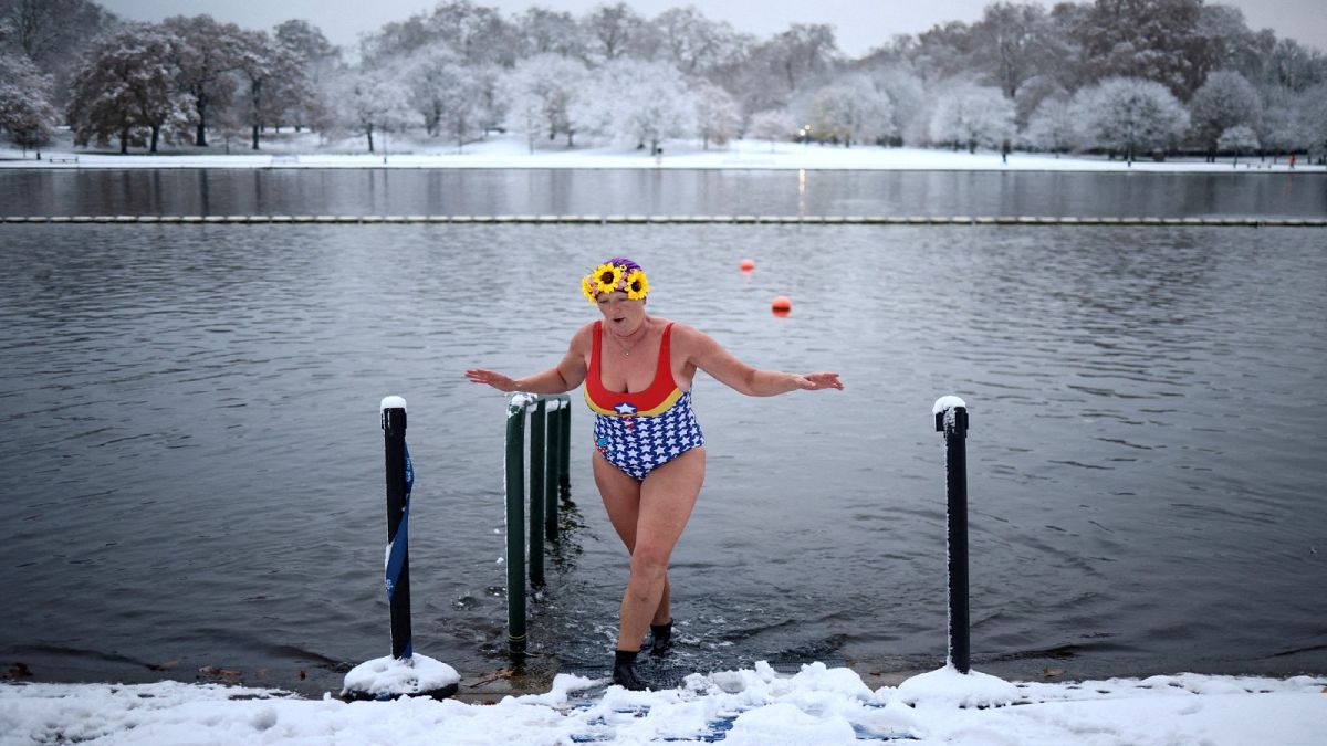 A swimmer dips her feet in Serpentine lake, as cold weather continues, in London, Britain, December 12, 2022.