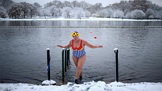 A swimmer dips her feet in Serpentine lake, as cold weather continues, in London, Britain, December 12, 2022.