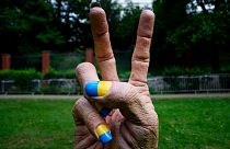 A statue of a hand with finger nails painted in Ukraine's national colors was placed in front of the Russian embassy in Prague, Czech Republic
