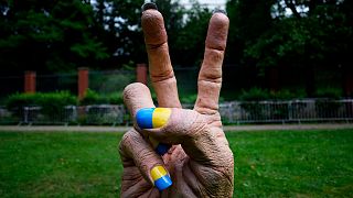 A statue of a hand with finger nails painted in Ukraine's national colors was placed in front of the Russian embassy in Prague, Czech Republic