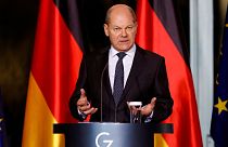 German Chancellor Olaf Scholz holds a news conference following a virtual meeting with fellow G7 leaders, in Berlin, Germany, 12 December 2022.