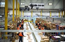 Employees work at an Amazon delivery station in Rozenburg on November 30, 2022.