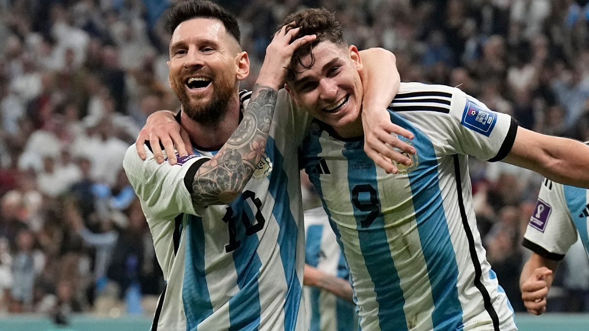 Argentina's Lionel Messi, left, and Argentina's Julian Alvarez celebrate after scoring during the World Cup semifinal soccer match against Croatia, 13 December 2022